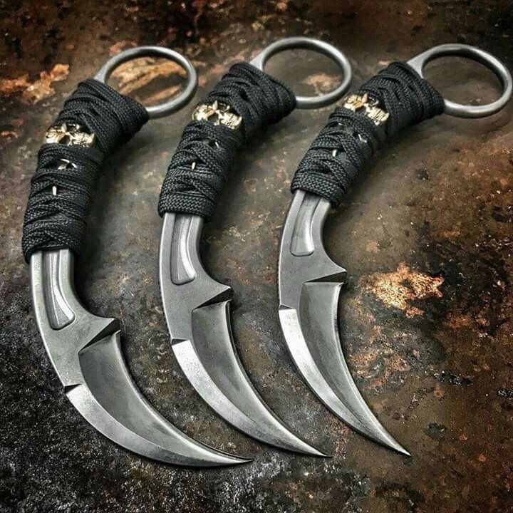 Trio of trainer karambits with paracord wrap